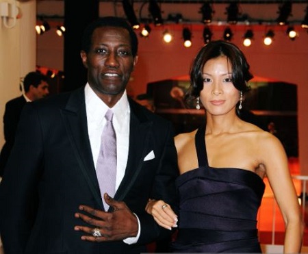 Wesley Snipes and Nakyung "Niki" Park attend the premier